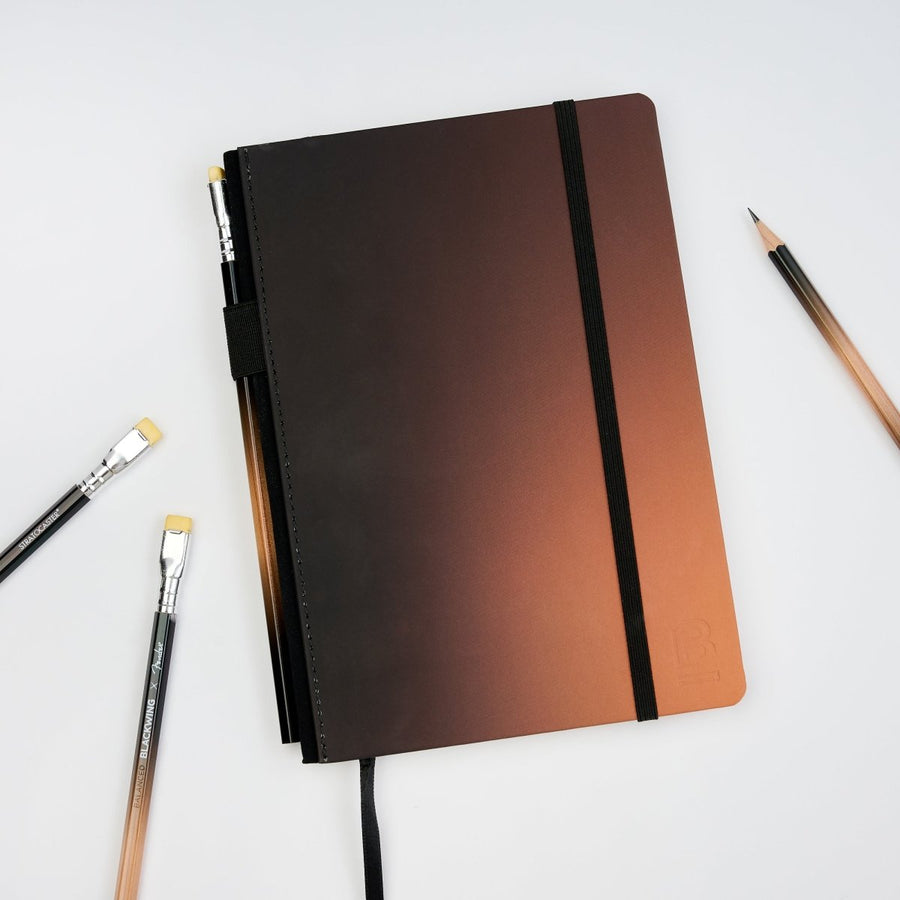 Blackwing x Fender notebook, featuring the sunburst stratocaster colorway of black and brown/orange