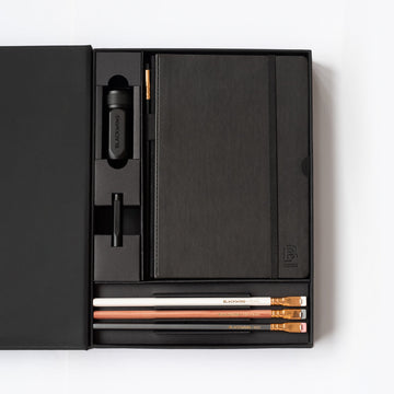 A Blackwing Notebook Essentials Set with Blackwing pencils inside.